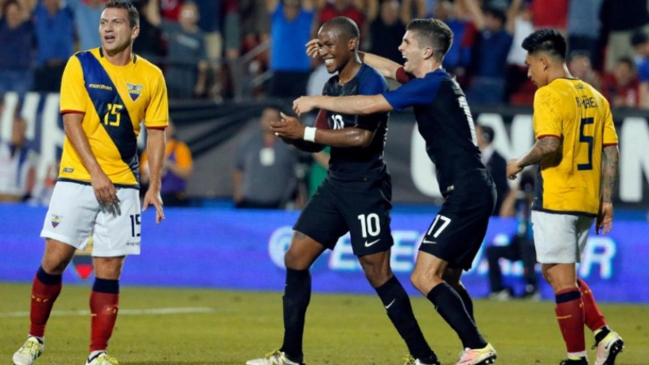 Dagbe and Pulisic celebrate after the Americans finally broke through 