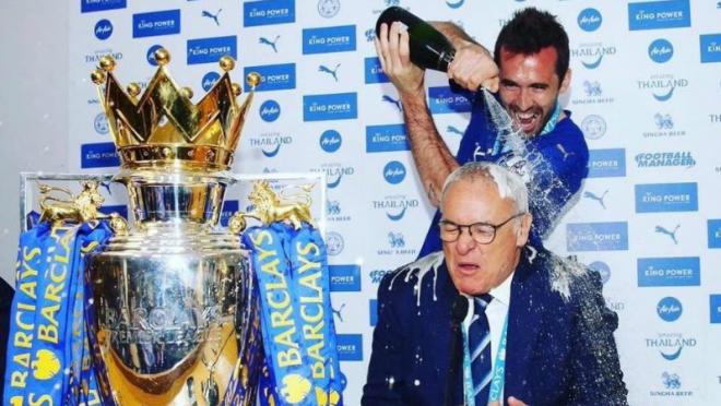 Christian Fuchs showering his manager, Claudio Ranieri, with champagne. Underdogs Leicester City.