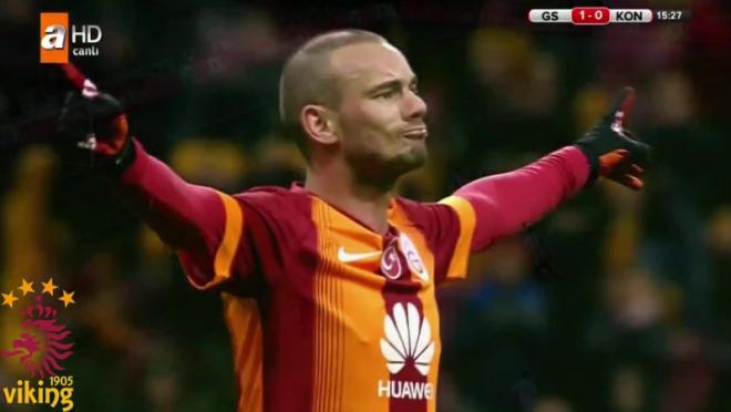 Sneijder celebrating, arms raised, with Cantona-esque bravado. 