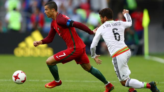 Cristiano Ronaldo takes on Jonathan dos Santos