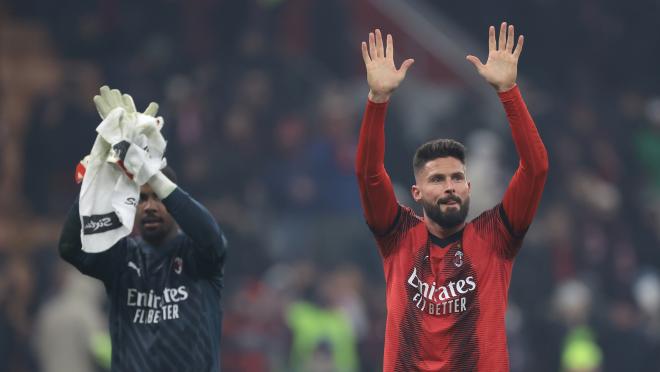 Olivier Giroud salutes fans at San Siro