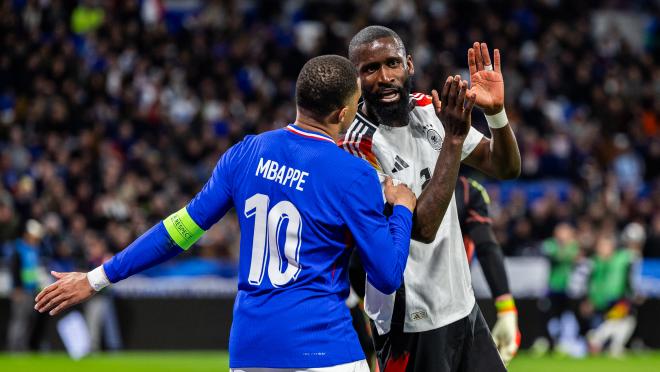 Antonio Rüdiger with Kylian Mbappé