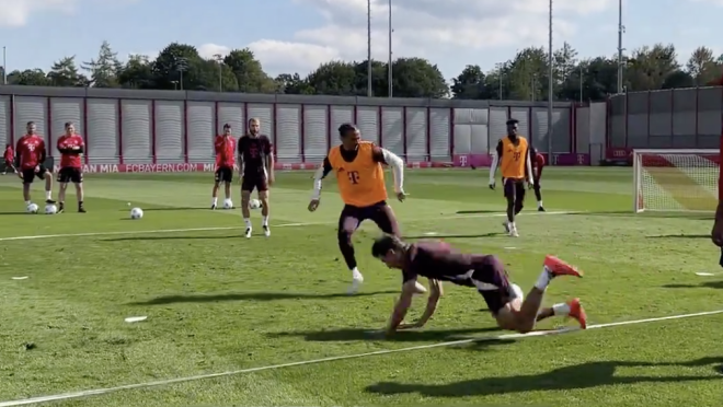 Thomas Muller trips during Bayern training