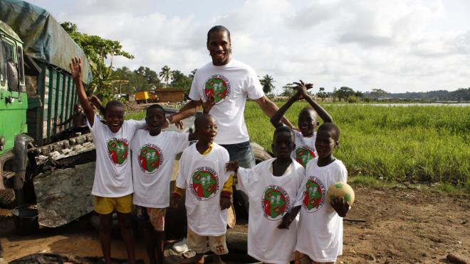 Didier Drogba helping the Ivory Coast 