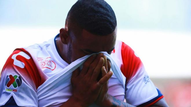 A Veracruz player hangs his head in shame after a brutal loss