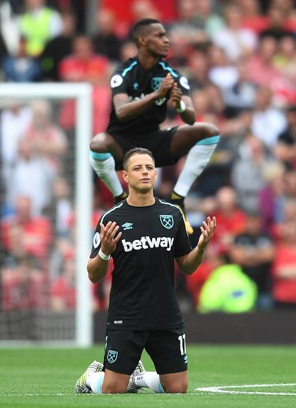Chicharito kneels after he misses a goal