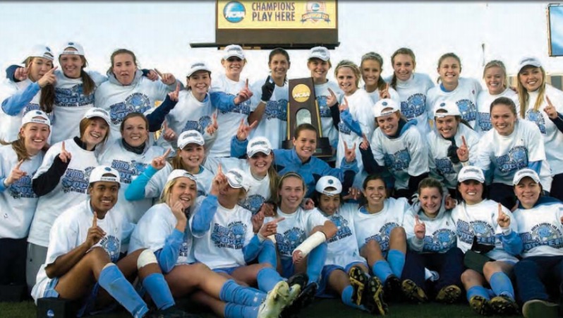 the 2008 UNC national championship team. Yael is pictued without a hat in the center.
