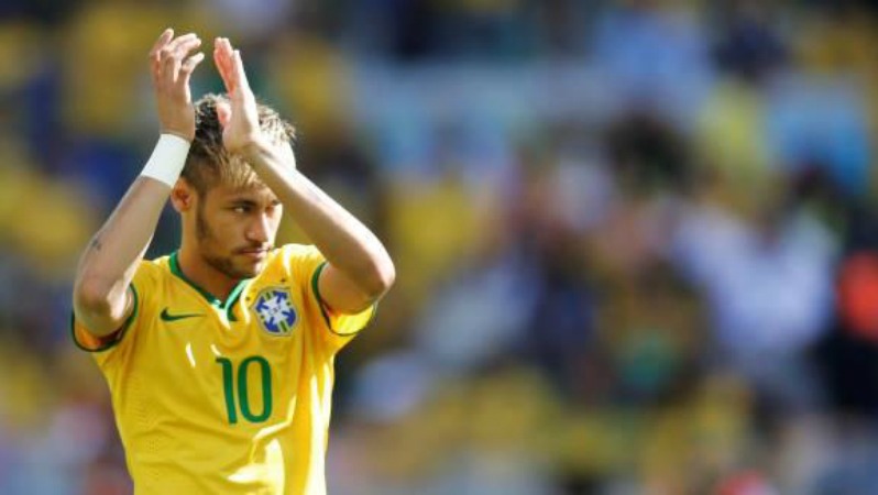 Barcelona attack: Neymar saluting fans while playing for Brazil.